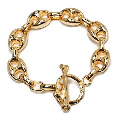 gucci cloth bracelet with gold plate|is gucci jewelry real gold.